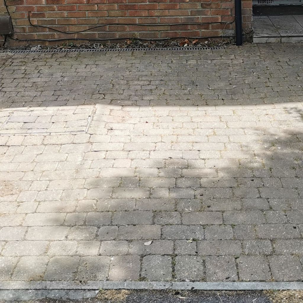 Same front garden after clearance, with the paving weeded and clean