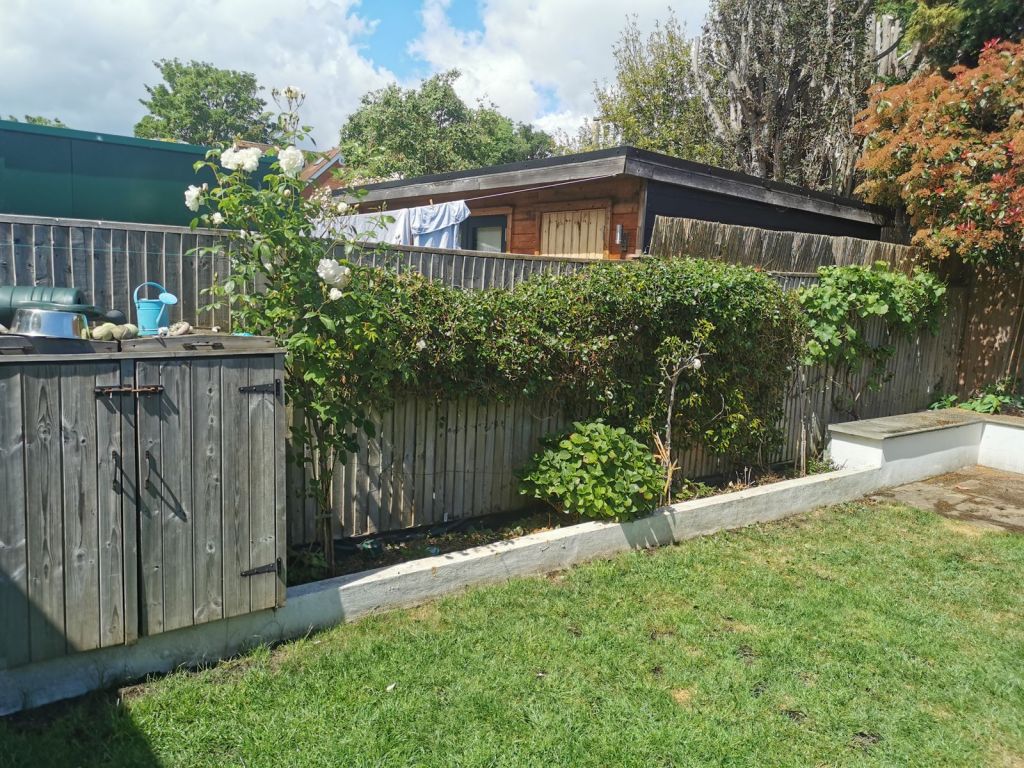 Tidy lawn with weeded raised beds