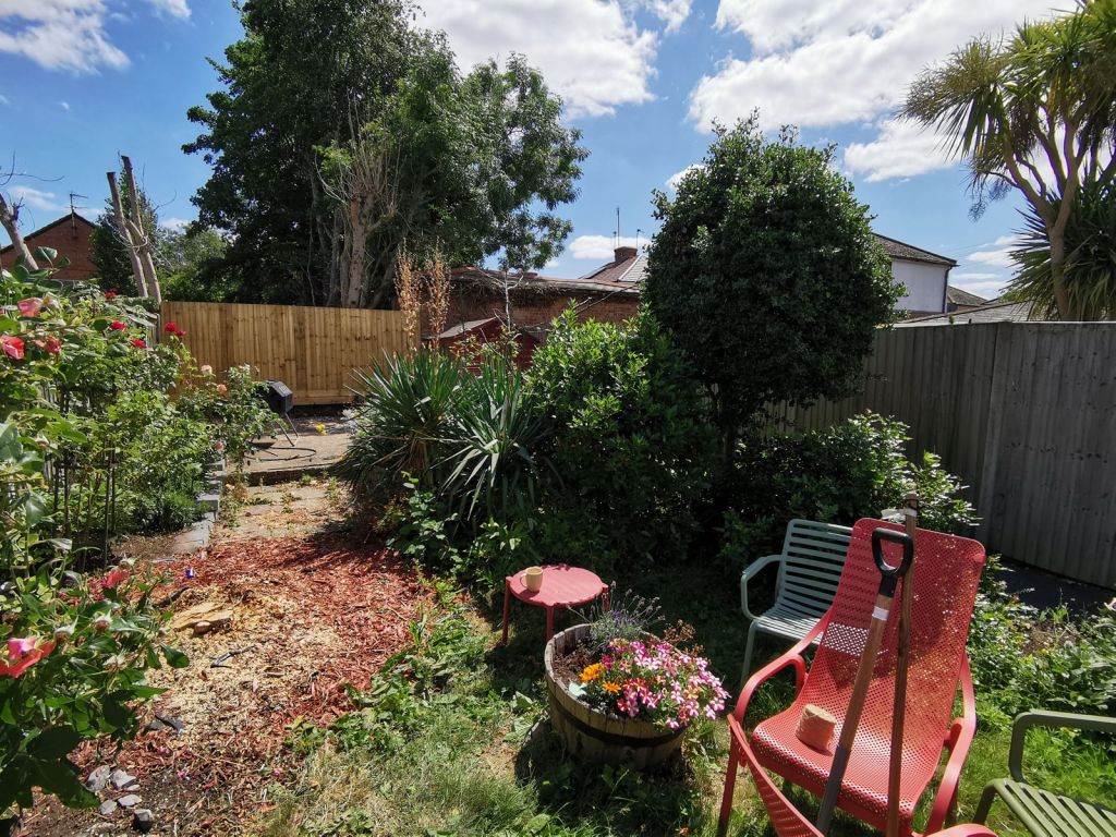 Weeded borders either side of a bark path