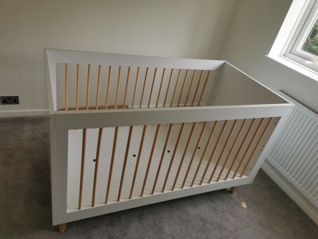 Assembled baby cot
