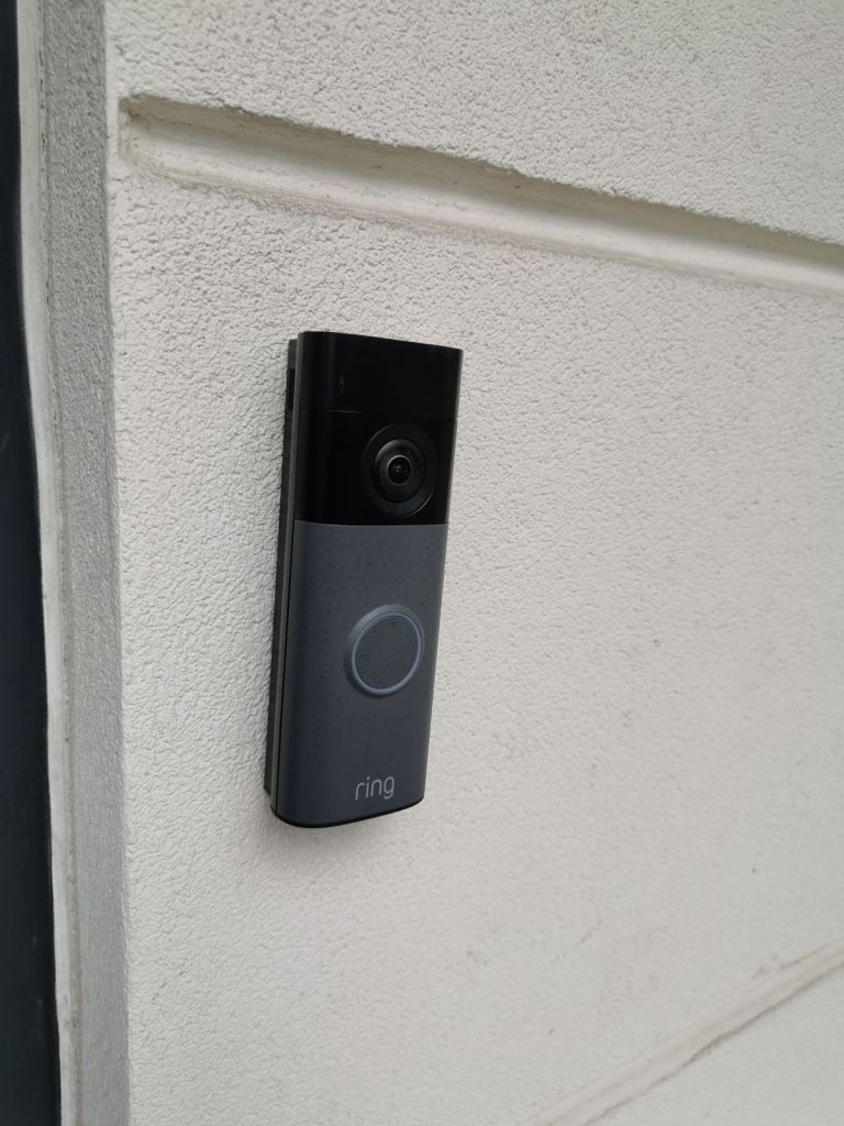 Video doorbell fitted beside a front door